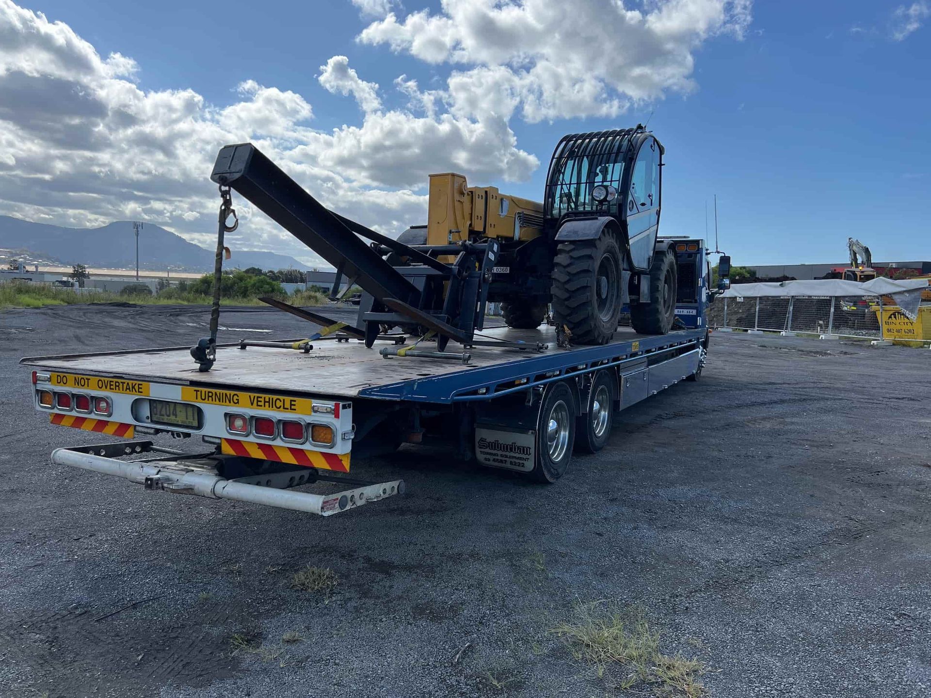 Heavy machinery loaded on a Buckley's Plant Maintenance truck in the Illawarra